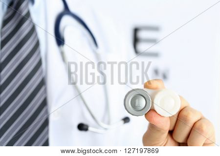 Male Doctor Hands Giving Pair Of Contact Lens In Case
