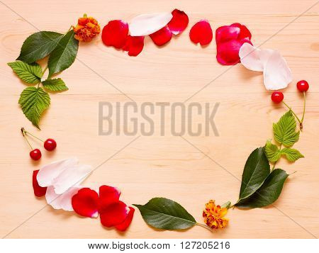 Frame On A Wooden Background Of Flowers And Leaves
