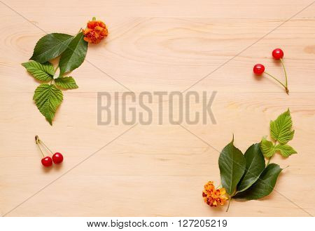 Frame On A Wooden Background Of Flowers And Leaves