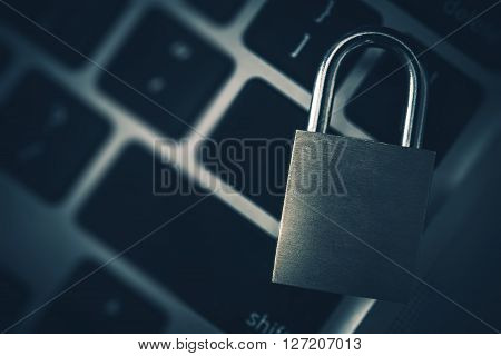 Encrypted Data Concept. Metal Padlock on the Computer Keyboard.