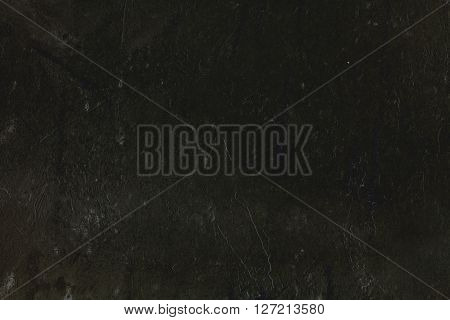 Heterogeneous dark background with traces of spatula.