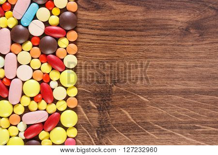 Heap of colorful medical pills capsules or supplements for therapy concept of treatment and health care copy space for text or inscription
