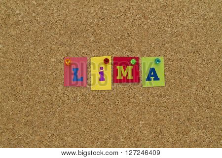 City name Lima written on colorful sticky notes pinned on cork board.