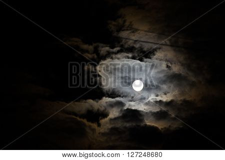 Night sky and a full moon in the clouds. Night sky and a full moon in the clouds