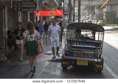 BANGKOK THAILAND - APR 10 : tuktuk wait for passenger near Lido Multiplex of Siam Square on april 10 2016 thailand. Tuktuk is name of three wheeled taxi car in thailand