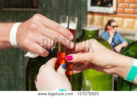 hands with alcohol tincture in test-tube liquor