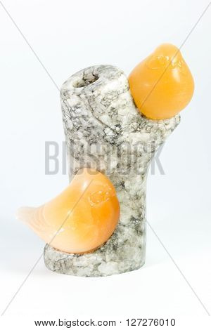 Two Amber Birds On Granite Tree On White Background