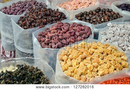 Dried sweet fruits for sale at market in Chinatown, Bangkok, Thailand