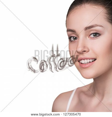Young woman inhaling coffee aroma isolated on white