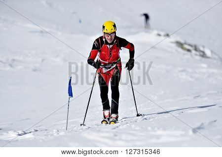 FAGARAS ROMANIA - MARCH 5: Ski mountaineer competes during the Ski Mountaineering National Competition in Fagaras Mountains on March 5 2016 in Romania.