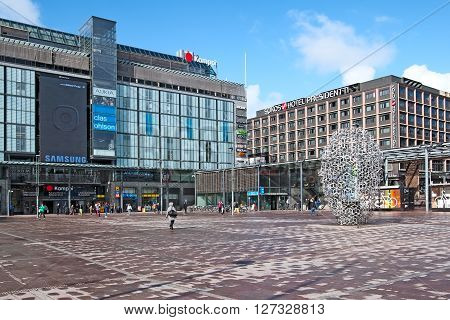 HELSINKI, FINLAND - APRIL 23, 2016: People on The Narinkka Square near Kamppi Center. Kamppi is shopping center, bus terminal, metro station. Narinkka comes from russian 