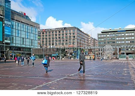 HELSINKI, FINLAND - APRIL 23, 2016: People on The Narinkka Square near Kamppi Center. Kamppi is shopping center, bus terminal, metro station. Narinkka comes from russian 