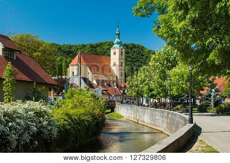 Samobor, Croatia - April 26nd, 2016: Catholic church and river in the center of Samobor, town in northern Croatia