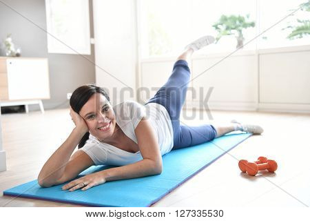 Woman doing workout exercises at home
