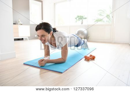 Woman doing workout exercises at home