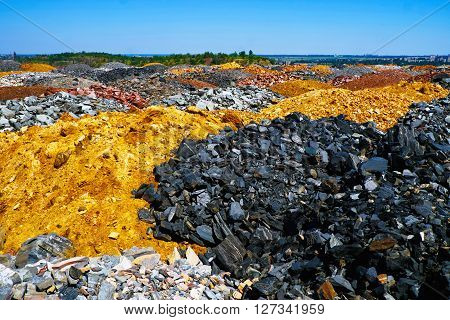 Field of colorful dumps of depleted iron ore