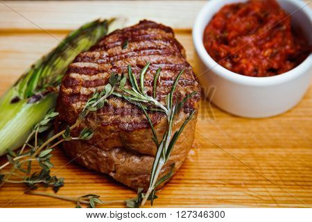 Beautiful Juicy Well Done Steak With Sauce On A Wooden Board