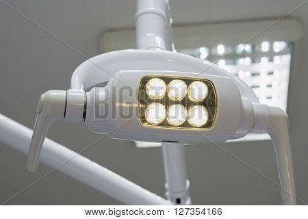 Glowing White Medical Shadowless Lamp With Yellow Light Background