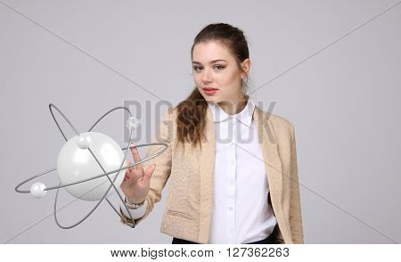 Woman scientist with atom model, research concept