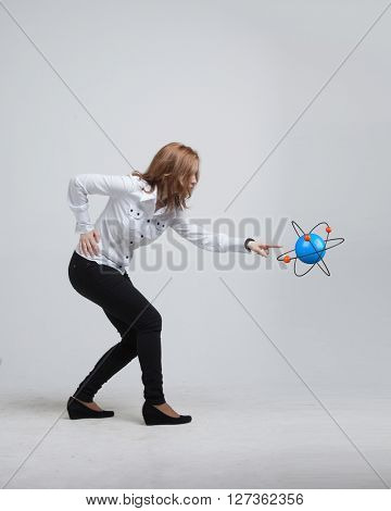Woman scientist with atom model, research concept