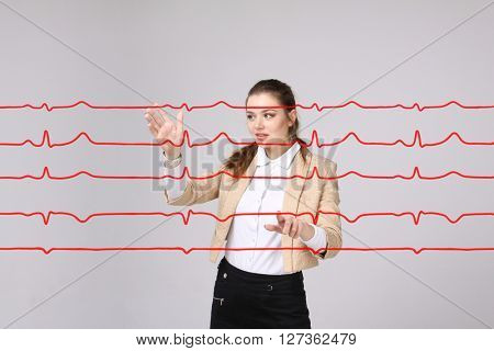 Doctor woman working with cardiogram lines