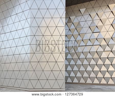Abstract close-up view of modern aluminum ventilated facade of triangles