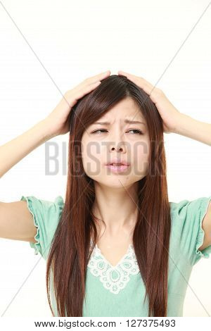studio shot of perplexed woman on white background