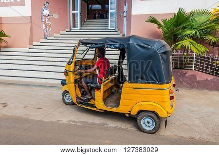 Hell-Ville Madagascar - December 19 2015: Traditional taxi customers waiting at the entrance to the restaurant at Hell Ville Nosy Be Island Madagascar.