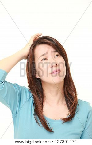 portrait of perplexed woman on white background