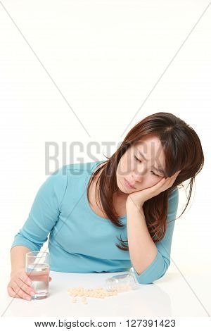 Japanese woman suffers from melancholy on white background