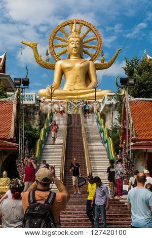KOH SAMUI THAILAND - JAN 23 2016 : Big buddha with many of tourist in the temple on January 23 2016 . One of the most famous landmark of Koh Samui Surat Thani Province Thailand