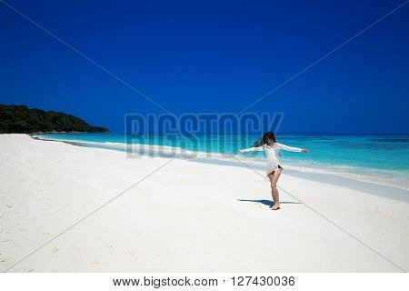 Enjoyment. Carefree Happy Woman Open Arms On Tropical Beach, Exotic Island. Summer Vacation. Brunett