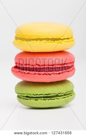 Close up of different color macaroons stacked up