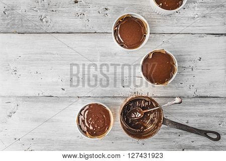 Chocolate dough for fondant in the ramekin horizontal