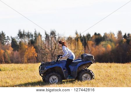 Elegant Woman Riding Extreme Quadrocycle Atv