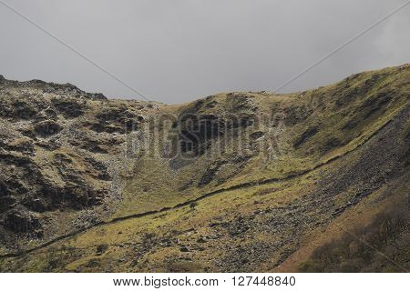 The Lady of Snowdon. Face profile feature on the flank of a steep hill in Snowdonia near Llanberis Gwynedd Wales UK
