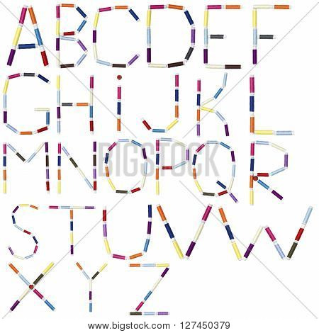 English alphabet made of spool sewing thread on white