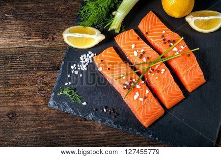 Salmon Filet Sliced On Three Parts With Lime And Herbs.