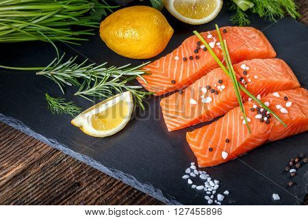 Salmon Filet Sliced On Three Parts With Lime And Herbs.