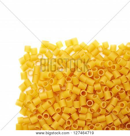 Pile of dry ditalini yellow pasta over isolated white background