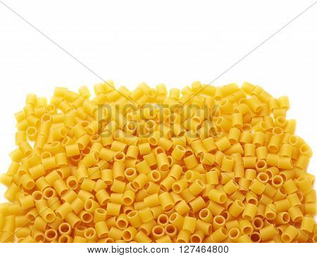 Pile of dry ditalini yellow pasta over isolated white background