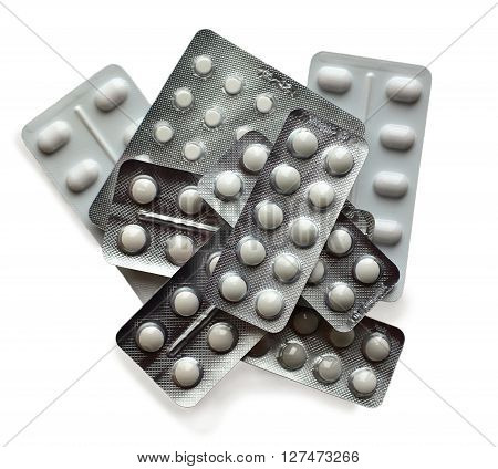 different white pills isolated on white background