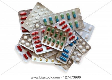 different molticoloured pills isolated on white background