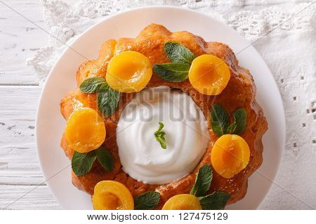 French Pastries: Savarin With Apricots And Mint Close-up. Horizontal Top View