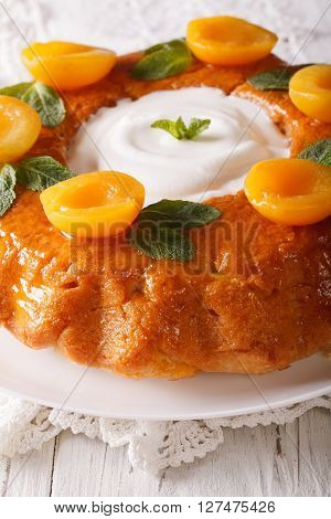 Savarin French Dessert With Apricots And Whipped Cream Close-up. Vertical