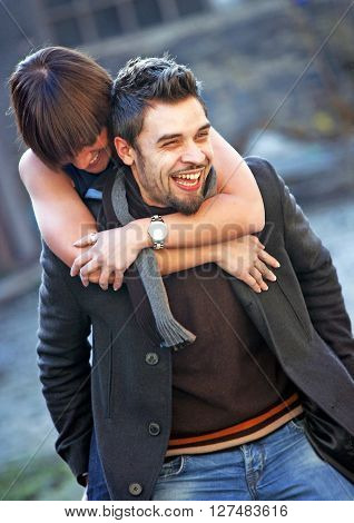 Young couple in love having fun outside