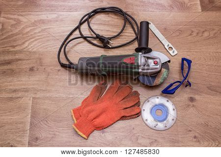 construction tools a broken wall overwrites the master of welding seams angle grinder