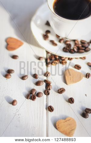 Morning coffee on a white background coffee beans scattered love and good memories.