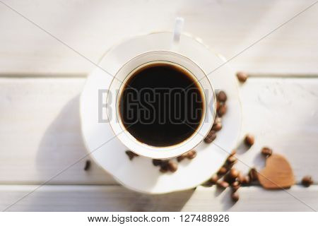 Morning coffee on a white background coffee beans scattered love and good memories.