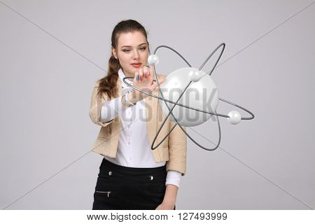 Woman scientist with atom model, research concept